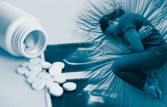 The photo montage shows a glass of tablets and a woman lying in a fetal position in her bed
