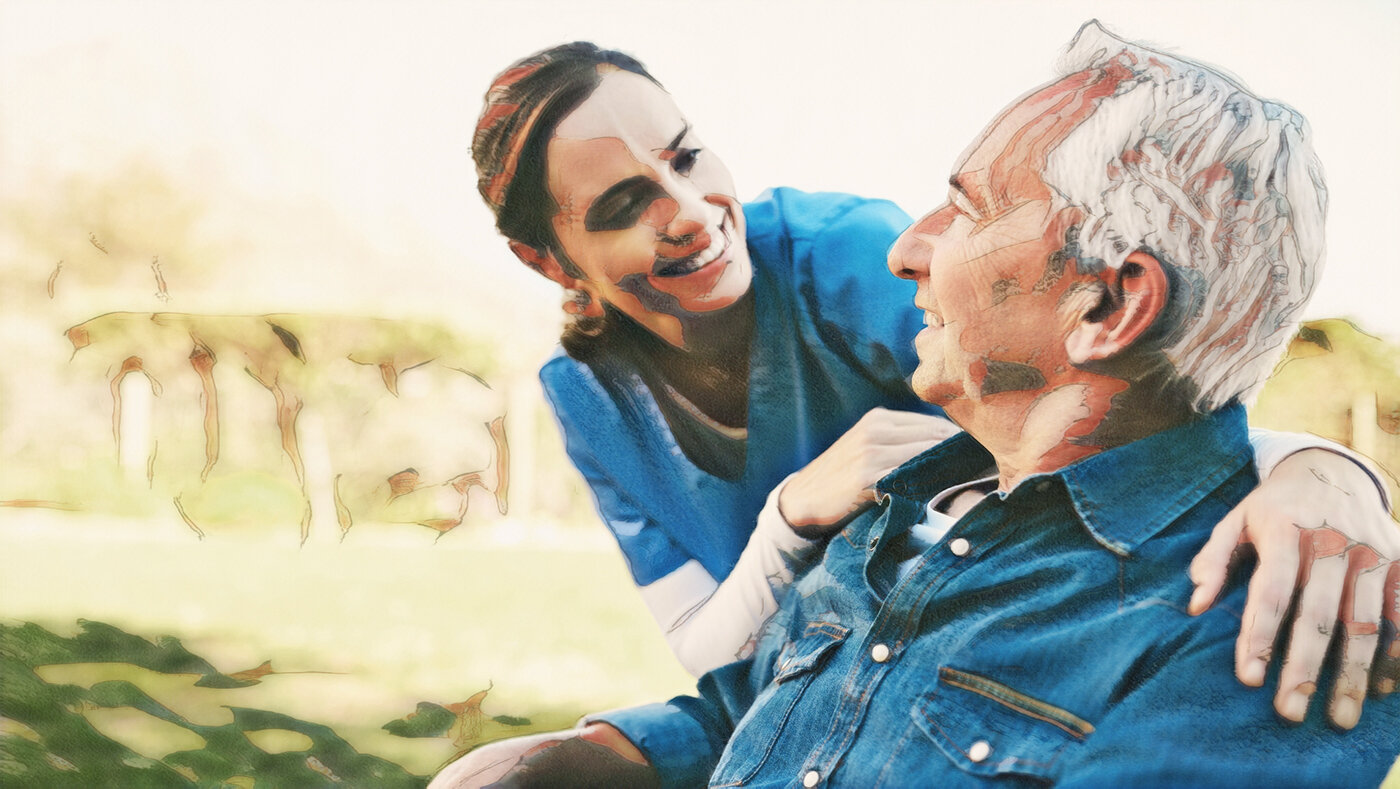 Bildet viser en sykepleier som er ute i en hage med en demenspasient