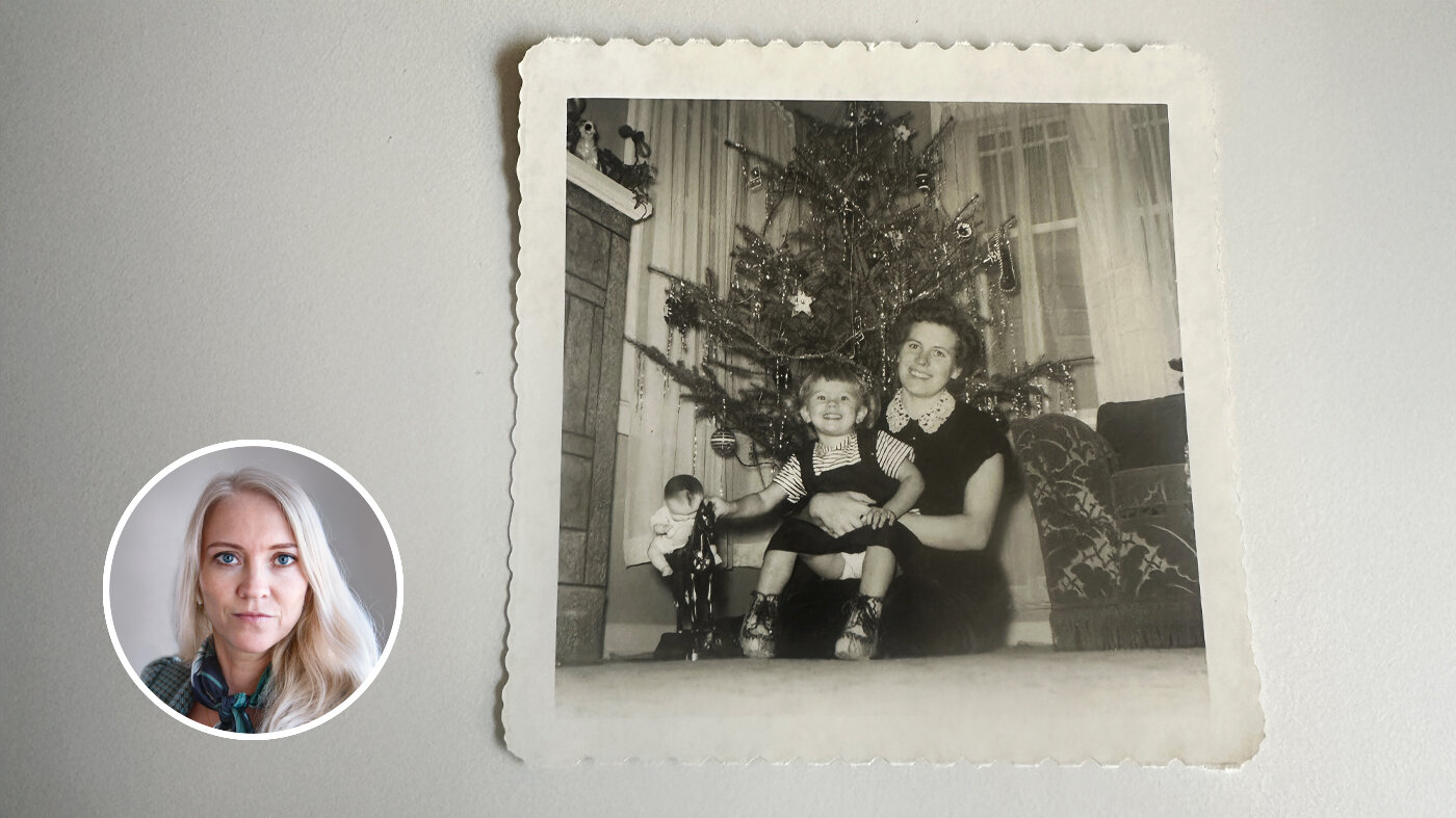 Bildet viser et gammelt fotografi av et barn og en mor.