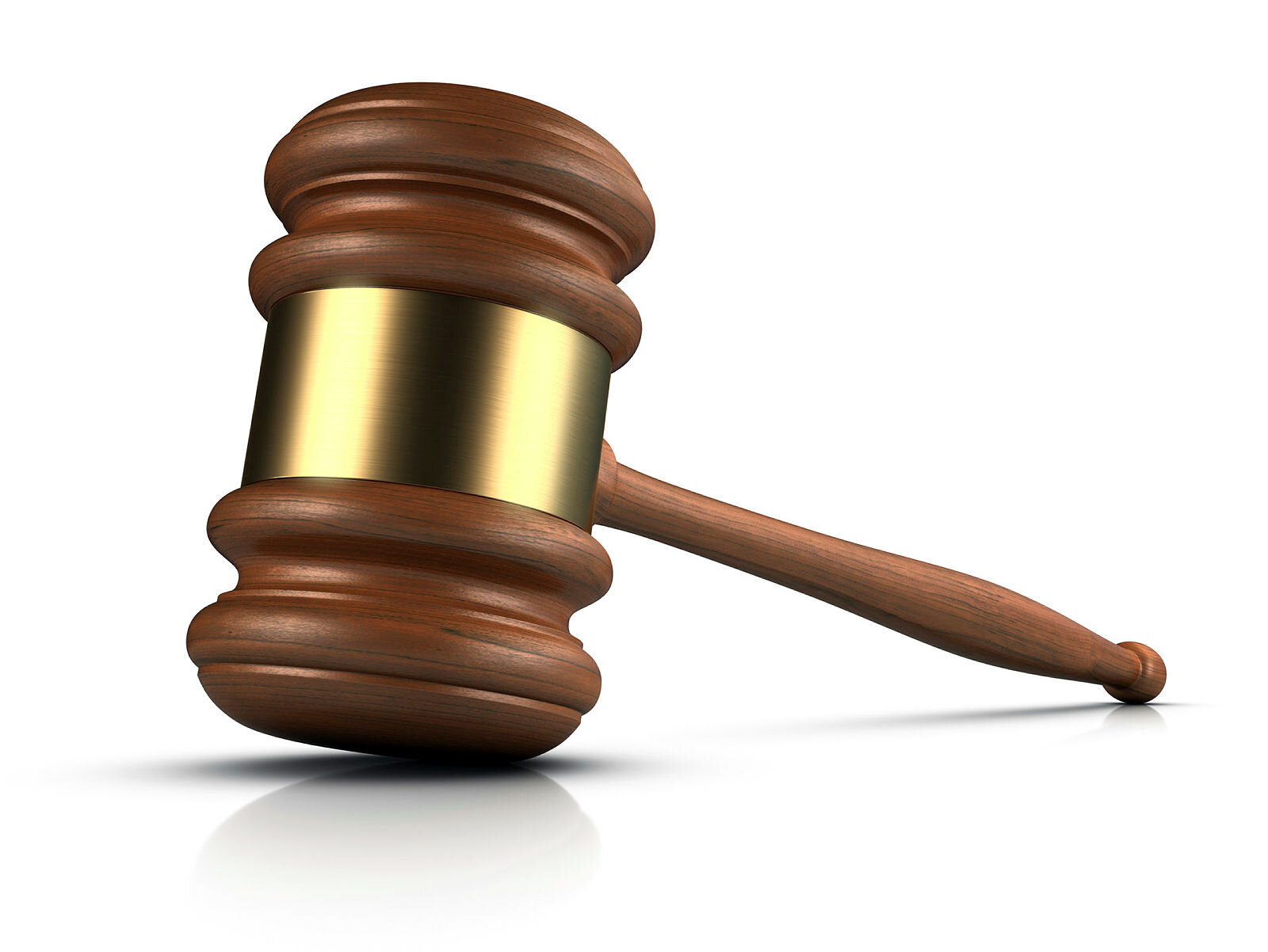 Bildet viser en dommerklubbe i mørkt treverk og gull.