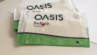 Vaskekluter Bildet viser to pakker med vaskeklutene av typen Oasis Bedbath.
