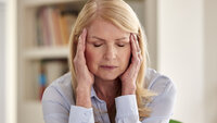 Kvinne med hodepine
